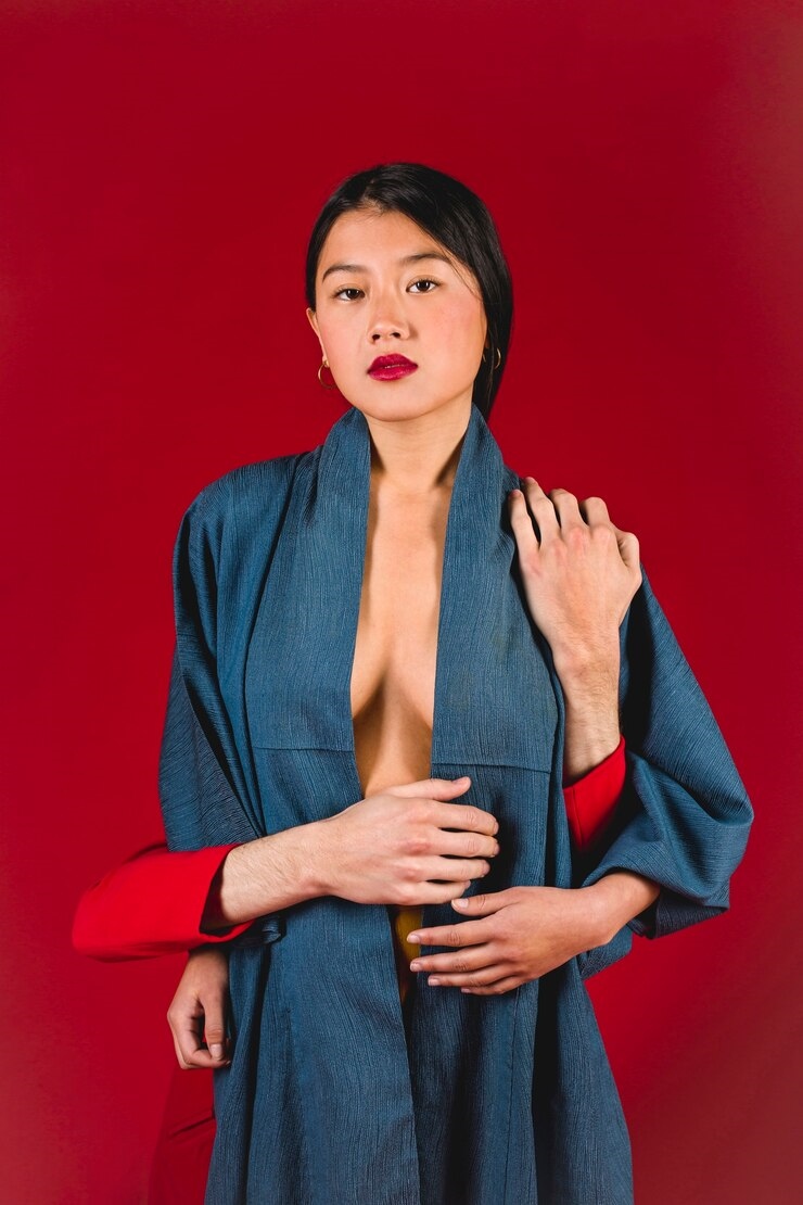 20250204233208-68fb9498dde1-young-woman-with-red-background_23-2148546980.jpg